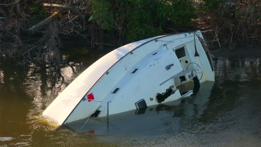Capsized yachts left forsaken on shore after hurricane Milton on Manasota Key in Englewood, Florida.