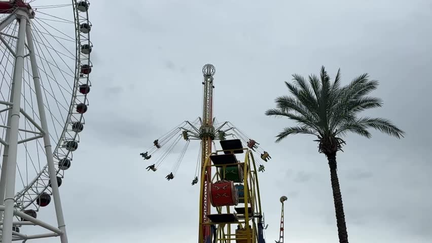 The people are having fun in a theme park, fair in Antalya, Turkiye