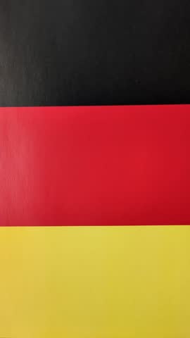 German citizen passport against the background of the German national flag as a background for your design
