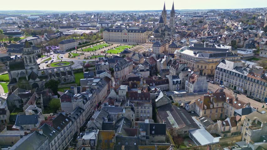 Beautiful panoramic drone movement around the place of Caen Town Hall and surrounding area with the Abbey of Saint-Étienne aka Men’s Abbey and the Church of the old Saint-Étienne, Caen, France.