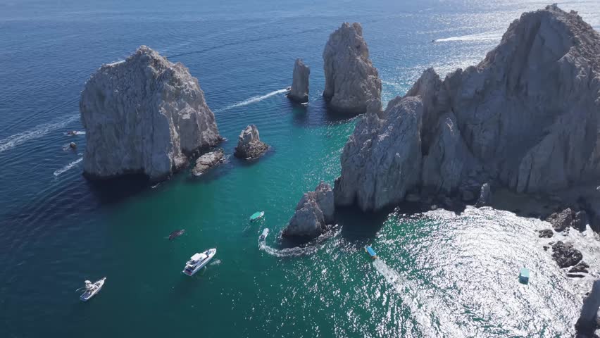 Aerial orbit over The Arch Of Cabo San Lucas, Tourist Destination On The Baja California Peninsula In Mexico.