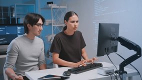 Two developers collaborating coding and software tasks modern workspace, utilizing teamwork and technology with programming computer monitor and tablet for coding developer software programmer code - Powered by Shutterstock - Get 15% off with code: PIKWIZARD15