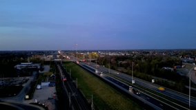 A breathtaking aerial view showcases a vibrant and bustling highway as it seamlessly transitions into the night - Powered by Shutterstock - Get 15% off with code: PIKWIZARD15