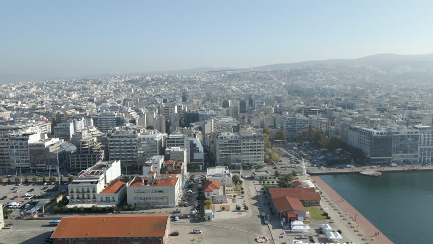 Thessaloniki Waterfront Buildings Greece Drone Track Left Morning Sun 4K 60FPS