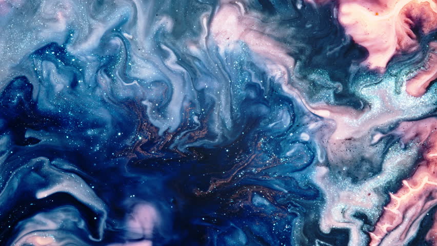 Swirling liquids and vibrant colors mixing together in a macro shot