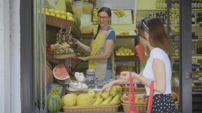 Woman buys fresh fruits in a store - Powered by Shutterstock - Get 15% off with code: PIKWIZARD15