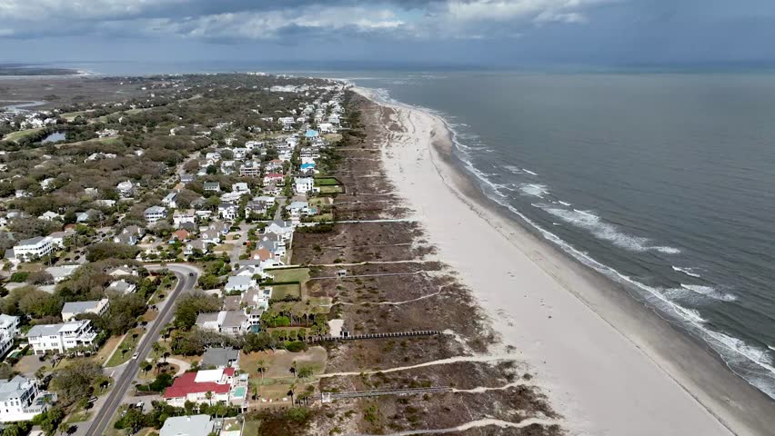 Aerial push down beachfront homes along the isle of palms beach near charleston sc, south carolina