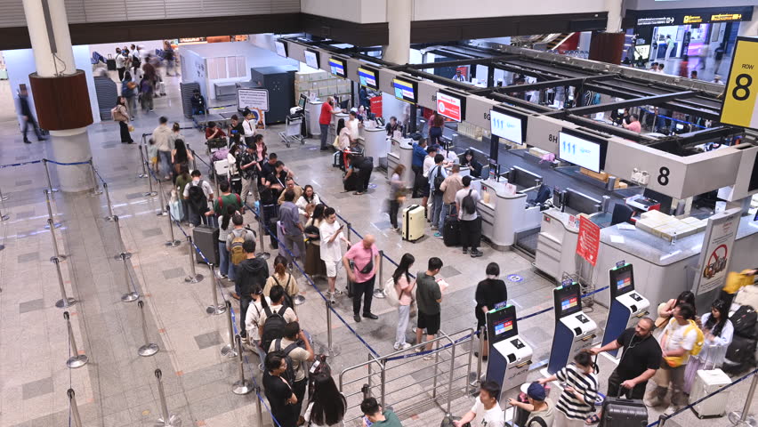 4K Time lapse crowd of passenger on check-in counter hall at Don Muang airport