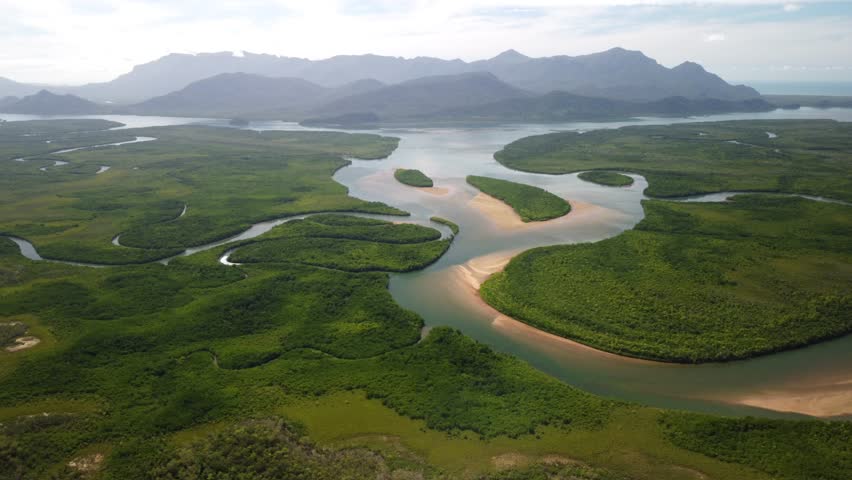 Pristine Beautiful Australian Coastal Landcape with mangroves, rivers and islands - Hinchinbrook Island Nationalpark from Above with blue sky
