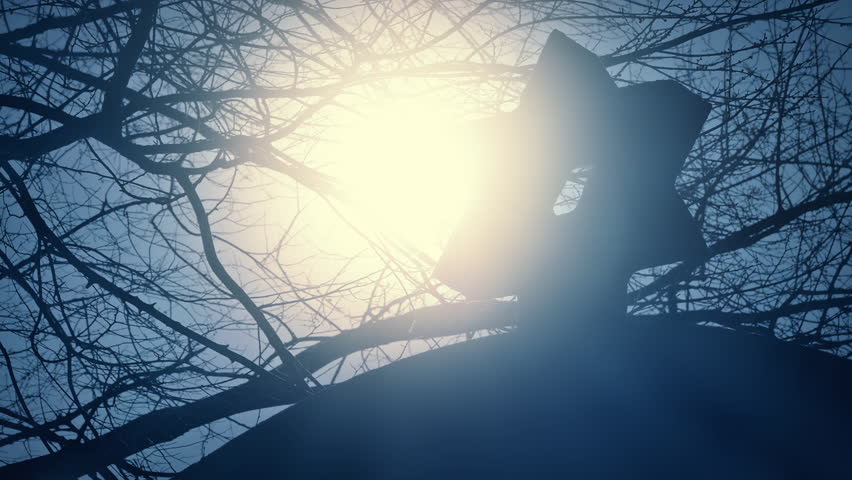 Sun Behind Monument At Jewish Cemetery