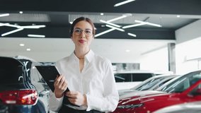Sales professional assisting customers in a modern car dealership showroom while showcasing vehicles and offering advice on purchases - Powered by Shutterstock - Get 15% off with code: PIKWIZARD15