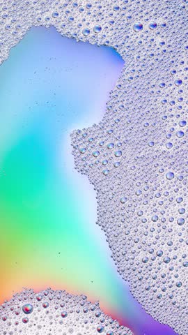 Foam background. Liquid soap bubbles, Froth bubbles backdrop. Soap foam popping bubble rotating, white backdrop. Soap sud macro structure close-up. Clean, cleaning, washing, laundry