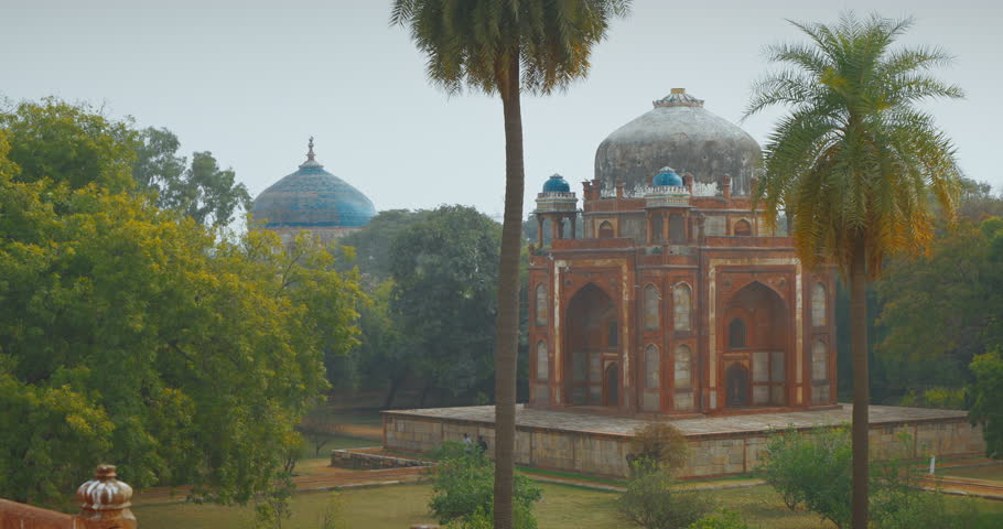 New Delhi, Delhi, India. Doves birds flying above Babur