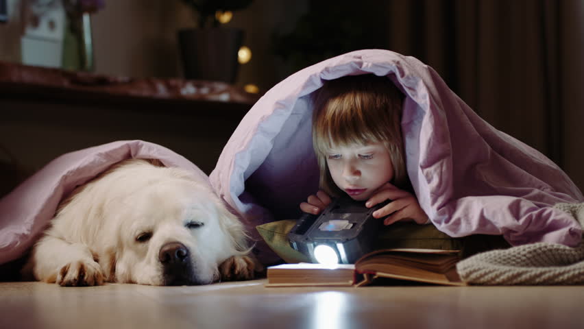 Tender Childhood Memories: A Boy and His Faithful Dog Sharing Quiet Reading Time Together in a Warm, Family Home