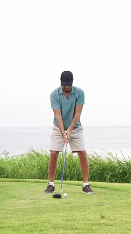 Adult Sports Man Playing on Green Golf Course and Hitting Ball with Club. Athletic Male Person is Real Winner at Championship Cup. Champion Kicking Golfball with Accuracy and Scoring with Birdie Slice