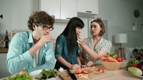 Attractive caucasian father and mother spend time together to cook fresh meal with asian daughter. Dad and mom preparing fresh vegetable for making salad at kitchen and eating vegetable. Pedagogy. - Powered by Shutterstock - Get 15% off with code: PIKWIZARD15