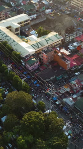 Vertical aerial of people on the streets in Makati, Undas in the Philippines