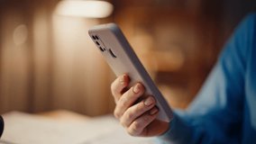 Woman hands tapping smartphone in dark apartment in lamp light closeup. Unrecognizable lady making online purchase by cellphone app in night home. Young freelancer browsing message on mobile phone. - Powered by Shutterstock - Get 15% off with code: PIKWIZARD15