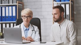 A dietitian advises a man patient about nutrition and dietary choices while seated at a desk in a contemporary clinic. The interaction focuses on lifestyle improvements and healthy eating. - Powered by Shutterstock - Get 15% off with code: PIKWIZARD15