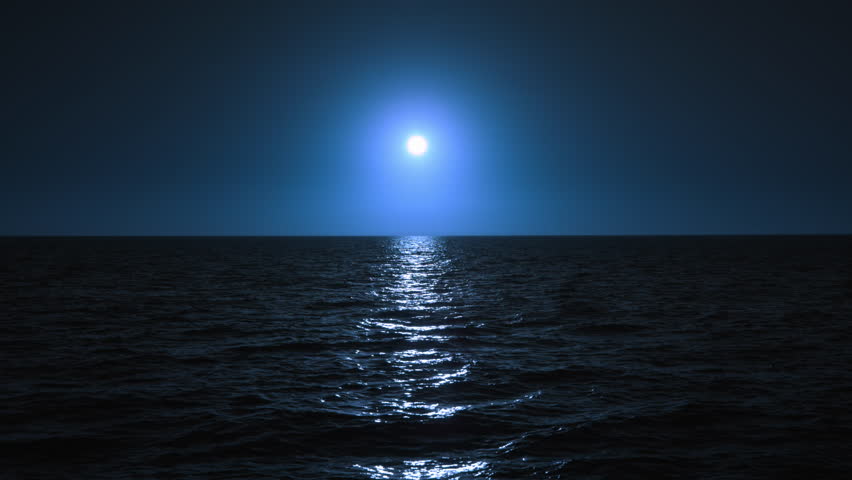 Experience the oceans tranquil beauty at night, illuminated by the bright moon. The slowmotion view reveals the waters surface reflecting the moons glow, creating a calm, peaceful atmosphere