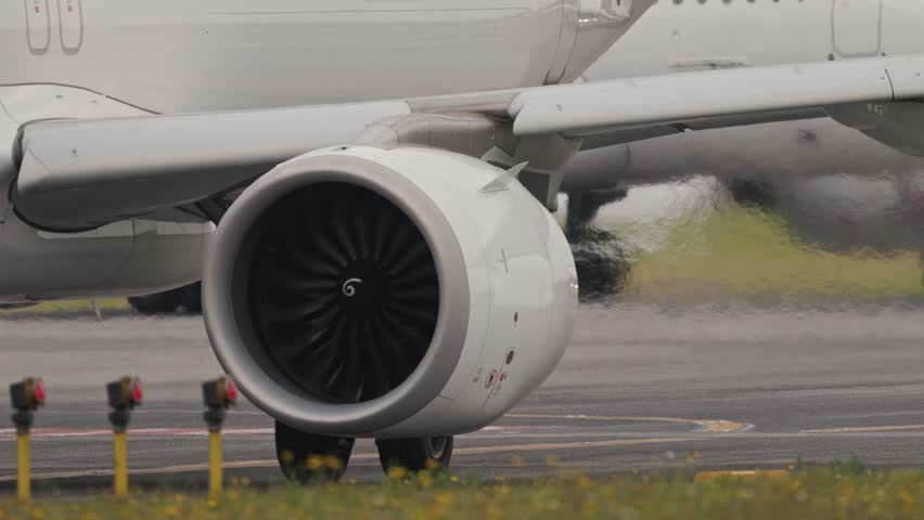 Airplane engine exhausting hot air on runway