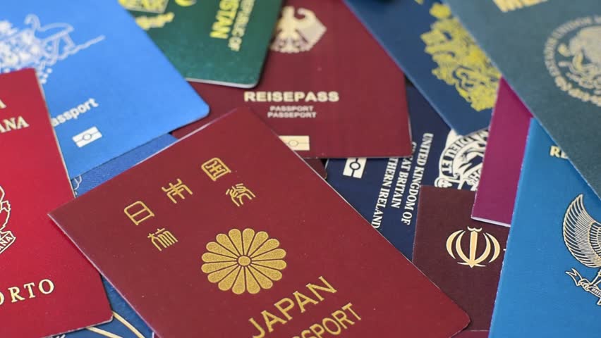 Background consisting of passports of different countries as conceptual wallpaper for your design