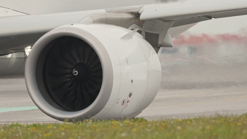 Airplane engine exhausting hot air and water vapor during maintenance