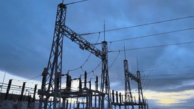 Electrical substation with industrial power lines at dusk, visualizing a negative electricity usage trend - Powered by Shutterstock - Get 15% off with code: PIKWIZARD15