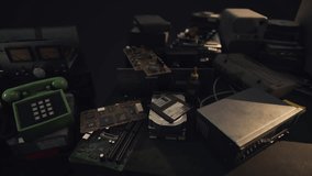 A collection of vintage electronics including circuit boards and an old phone sits on a dark table, showcasing the intricate designs and nostalgic technology of past decades. - Powered by Shutterstock - Get 15% off with code: PIKWIZARD15