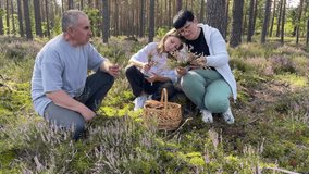 Grandparents making heather crown for granddaughter in forest - Powered by Shutterstock - Get 15% off with code: PIKWIZARD15