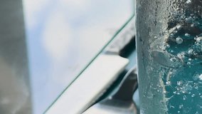 Macro view of club soda bubbles rising in a glass, set against a dining table with cutlery, in natural light - Powered by Shutterstock - Get 15% off with code: PIKWIZARD15