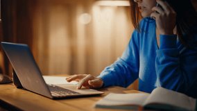 Woman making order by call sitting evening living room browsing laptop online store closeup. Confident businesswoman talking cellphone looking computer. Smiling female manager consulting by phone late - Powered by Shutterstock - Get 15% off with code: PIKWIZARD15