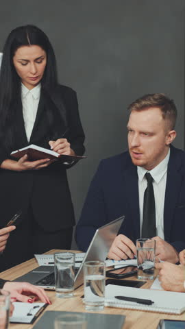 Boss leads meeting and gives instructions. Employees listen attentively and take notes. Teamwork and collaboration in professional business environment. Concept of leadership and management
