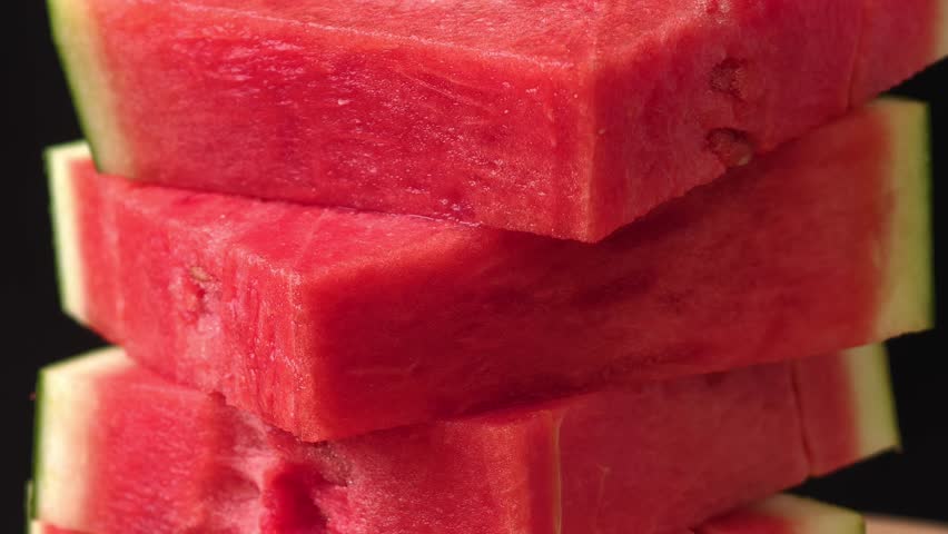 Watermelon slices on black background	