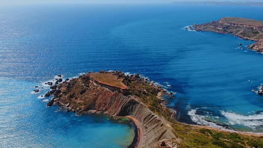 Ghajn Tuffieha Golden bay on Malta island, aerial top view.