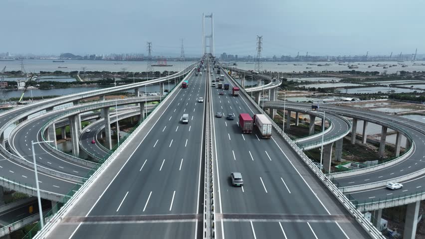 Multi-level bridge China. Cars drive transport interchange. Road traffic. Chinese ship sails, freight cargo logistic. Aerial top drone view, fast urban highway. Modern city freeway. Shipping delivery.