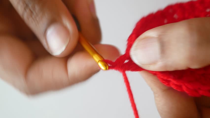 Learn crochet techniques with simple red yarn patterns