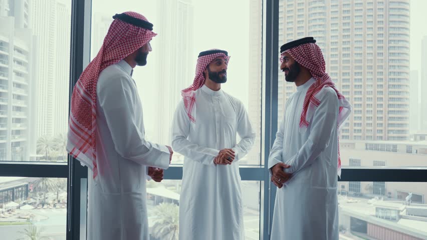 Cinematic video of a group of businessmen from Saudi arabia during an corporate meeting in an office.