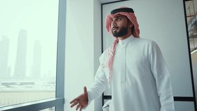 Cinematic video of a group of businessmen from Saudi arabia and Dubai during an corporate meeting in an office. Mixed business team from different parts of the UAE working together. - Powered by Shutterstock - Get 15% off with code: PIKWIZARD15