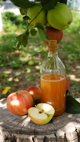 apple cider vinegar in the garden. Selective focus.