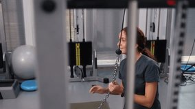 physical rehab, child fitness, mobility stretch. Female rehabilitation expert supports child through leg stretch with physical training tools. - Powered by Shutterstock - Get 15% off with code: PIKWIZARD15