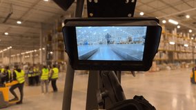 Point of view from inside an electric cart driving through a warehouse. The driver is looking at a control monitor mounted on the dashboard. Modern warehouse technology, inventory management, logistic - Powered by Shutterstock - Get 15% off with code: PIKWIZARD15