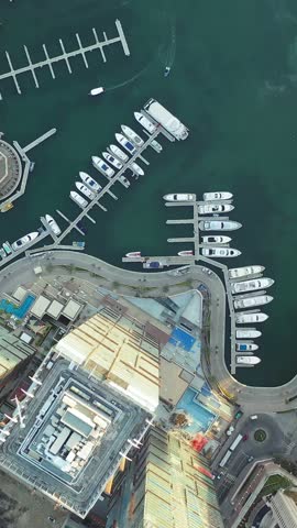 Aerial view of iconic skyscrapers and heavy traffic in Downtown Dubai, UAE. Modern skyline with luxury architecture, urban lifestyle, business district, finance hub, and smart city concept