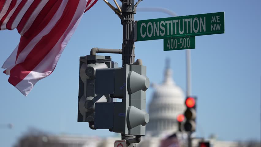 American construction flag waving. American construction at Capitol. Capitol in Washington DC. American construction site in Capitol. Construction and democracy in action. Vote and elect in America.