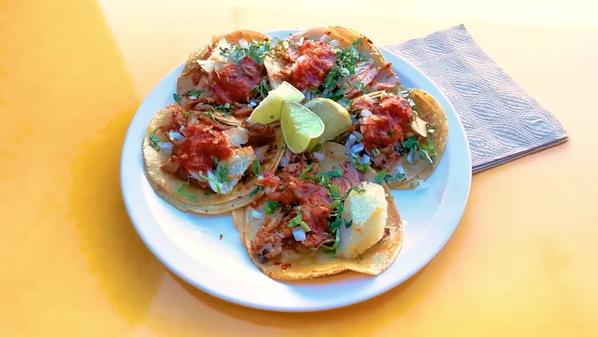 Mexican tacos with lime hot sauce pineapple and onions in Centro Historico Mexico City Mexico.