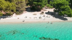 Aerial view of Playa de Formentor at Cala Pi de la Posada bay in Mallorca. Stunning beach with people swimming in turquoise waters at Cap Formentor, Majorca, Balearic Islands, Spain. - Powered by Shutterstock - Get 15% off with code: PIKWIZARD15