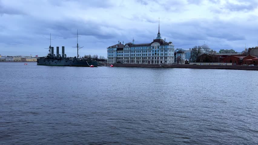 St. PETERSBURG, RUSSIA - April 20, 2024: The Aurora Cruiser Museum on the Neva River on a 20th-century warship. View of the cruiser Aurora, a historical warship, now a war memorial museum. 4К