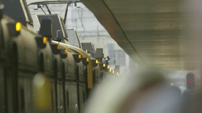 Passengers waiting for arriving train at station platform - Powered by Shutterstock - Get 15% off with code: PIKWIZARD15