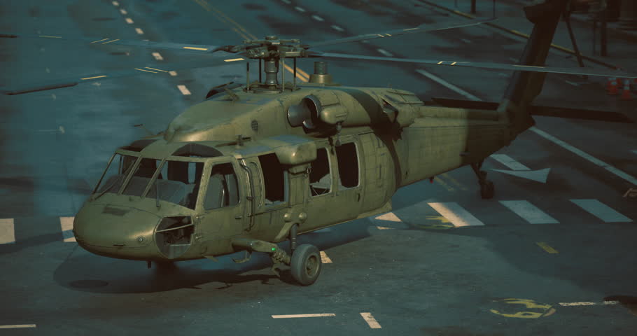 A military helicopter sits on a city street, showing signs of recent action. The environment is urban, with muted colors and hints of evening light, creating a dramatic atmosphere.