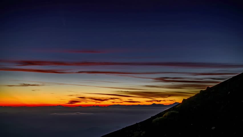 Dramatic Sunset Over Mountaintop Cloudscape